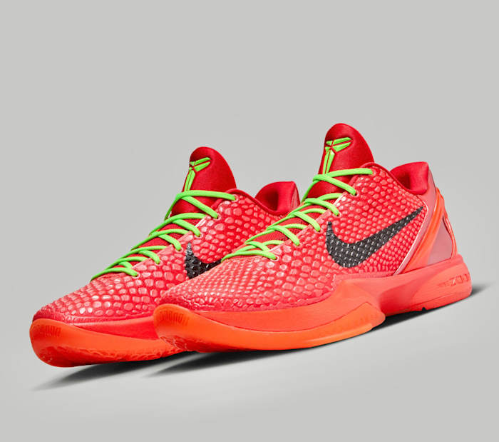 Side view of Kobe Bryant's red and green Nike sneakers.
